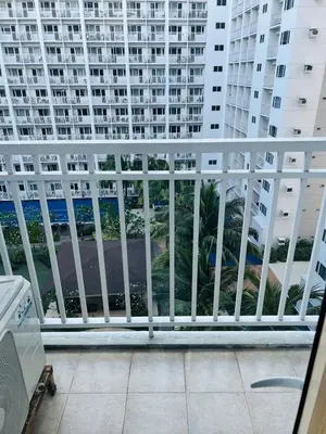 a balcony with a view of a large building at Apartment Rm# 839 B shore 1 in Manila