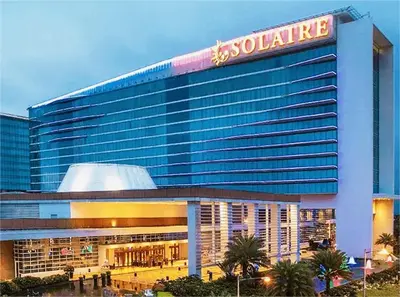 a large building with a sign on top of it at Mall Of Asia - Shore2 Residences in Manila