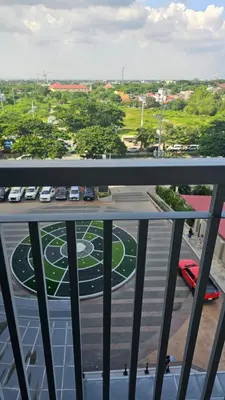 a view from a balcony of a parking lot at Smdc green 2 residence in Pasong Bayog