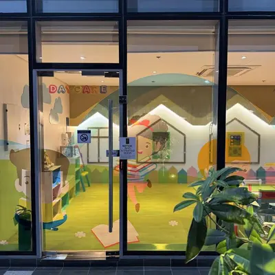 a store window with a painting of a play area at Elegant 1BR with Great View, Panoramic Pool Near Ortigas CBD - 24 in Manila