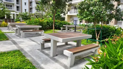 a group of picnic tables and benches in a park at The Atherton- Spacious Modern Condo Unit in Paranaque Near the Airport, Makati, BGC and Highways in Manila