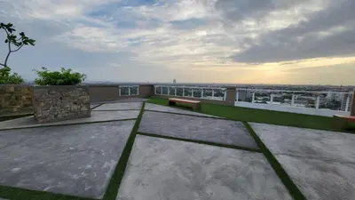 a balcony with two benches on a building at The Atherton- Spacious Modern Condo Unit in Paranaque Near the Airport, Makati, BGC and Highways in Manila