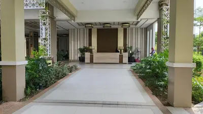 an empty hallway of a building with plants at The Atherton- Spacious Modern Condo Unit in Paranaque Near the Airport, Makati, BGC and Highways in Manila