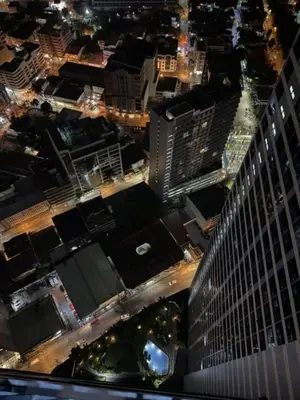 an aerial view of a city at night at Condo in Makati, Casa Beatrice in Manila