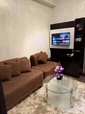 a living room with a couch and a coffee table at Condo in Makati, Casa Beatrice in Manila
