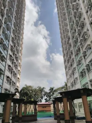 a view from between two tall buildings at Casa Lily in Manila