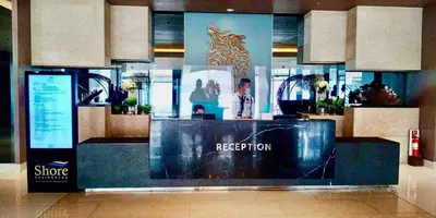 a store with a reception counter in a mall at 1BR Room-Stunning MOA view FIREWORKS in Manila