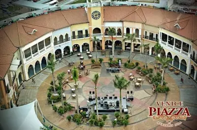 an overhead view of a building with a courtyard at M&M Suites Ridgewood Towers T3 BGC McKinley in Manila