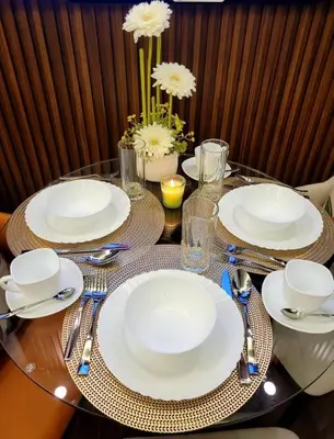 a table with white plates and silverware on it at Air Residence T1 Amazing Makati Luxury Condo 66 sq m 300Mbps Fast in Manila