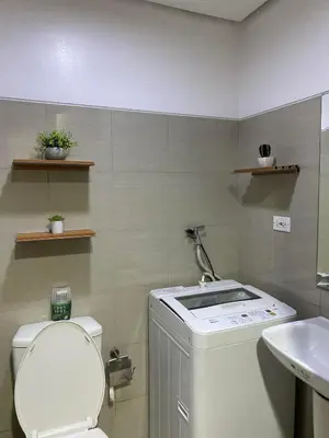 a bathroom with a toilet and a sink at COZY PASAY CONDOMINIUM HOTEL UNIT with NETFLIX in Manila