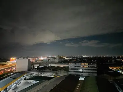 a view of a city skyline at night at Cozy fully furnished 2 BR unit in Manila