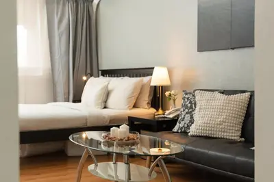 a living room with a couch and a coffee table at Studio Penthouse in Greenbelt - Park View & Pool in Manila