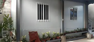 a front door with potted plants and a window at 40 Guest - Whole compound in Santa Rosa
