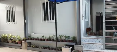 a group of potted plants sitting on a wall at 40 Guest - Whole compound in Santa Rosa