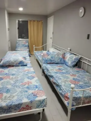 a room with three beds in a room at 40 Guest - Whole compound in Santa Rosa