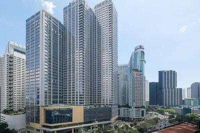 a city skyline with tall skyscrapers at Blush Haven with Netflix, WiFi and Balcony near Glorietta in Manila