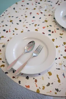 a white plate with a fork and spoon on a table at Blush Haven with Netflix, WiFi and Balcony near Glorietta in Manila