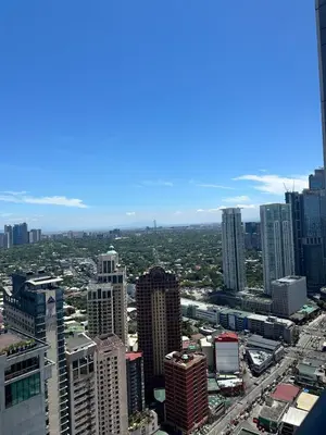 an aerial view of a city with tall buildings at Studio Unit with Balcony in The Gramercy Residences in Manila
