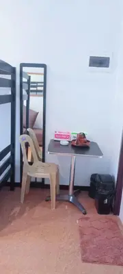a desk with a chair and a mirror in a room at Avida sm sucat condotel in Manila