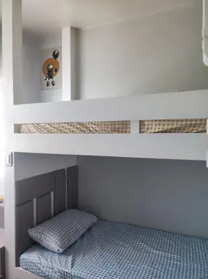 a bunk bed in a room with a bunk bedutenewayewayangering at Two Bedroom - Presidio Lakefront in Manila