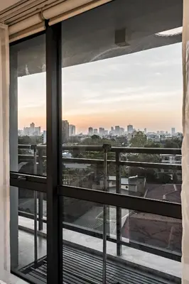 a view from a window of a city skyline at Makati City Centre Condo in Manila