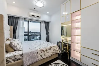a bedroom with a bed and a window at Makati City Centre Condo in Manila