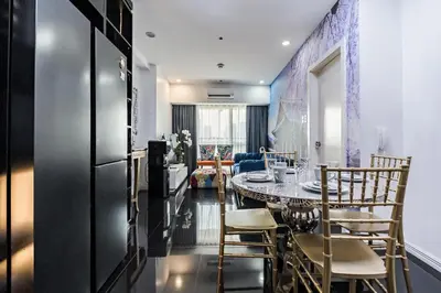 a kitchen and dining room with a table and chairs at Makati City Centre Condo in Manila