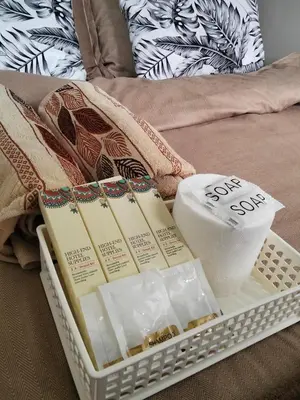a tray of soap and other items on a bed at Shore2 tower2 in Manila