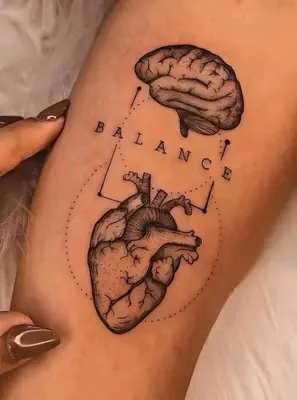 a woman with a heart and brain tattoo on her side at Cess in Manila