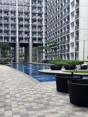 a building with a fountain in front of a building at Shore 2 Tower 3 Chic and Cozy by Richnells in Manila