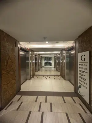 an empty hallway in a building with a sign on the wall at FLAIR Condotel 1 BR Near MRT EDSA Shangrila Megamall Lightmall in Manila