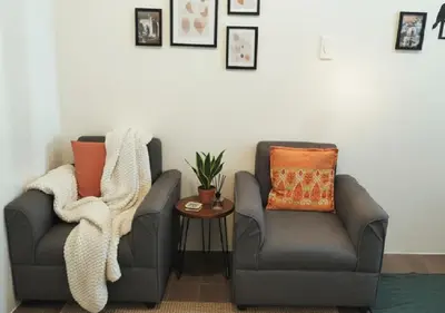 two chairs sitting next to each other in a room at Makati Business District Prime Accommodations in Manila