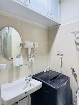 a bathroom with a sink and a mirror at Aesthetic Unit Near PICC and MOA in Manila