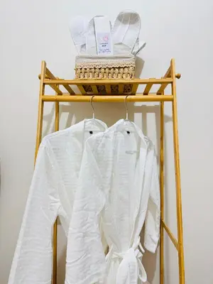 a rack with two white shirts on it at Aesthetic Unit Near PICC and MOA in Manila