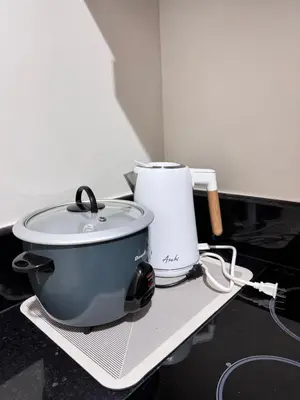 a slow cooker and a toaster sitting on a counter at Aesthetic Unit Near PICC and MOA in Manila