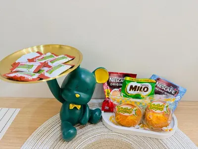 a toy turtle standing next to a plate of snacks at Aesthetic Unit Near PICC and MOA in Manila