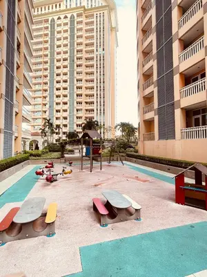 a swimming pool with benches in front of some buildings at Venetian Panorama BGC Venice Grand Canal Apart ment, 4 Bedrooms, for 10 Guests in Manila