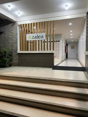 a laaza building with stairs in front of it at Elegant Escape Milano Bacoor Cavite in Bacoor