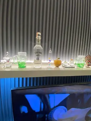 a bottle of alcohol sitting on top of a table at Elegant Escape Milano Bacoor Cavite in Bacoor