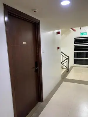 a brown door in a room with a hallway at Elegant Escape Milano Bacoor Cavite in Bacoor