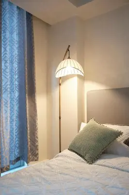 a bedroom with a bed with a lamp on it at Bahamas Tower Azure Urban Resort Residences by Nestled Nook in Manila