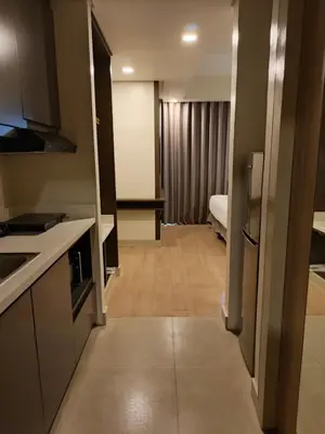 a room with a kitchen and a living room at Aura Luxe Stays at BCCT in Manila