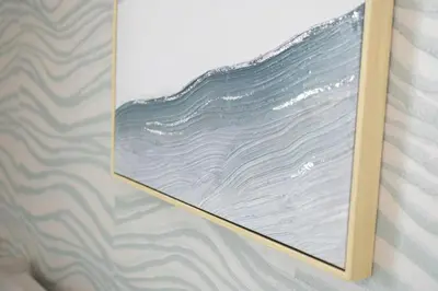 a picture of a painting on a wall at Manhattan Heights Modern Studio in Manila