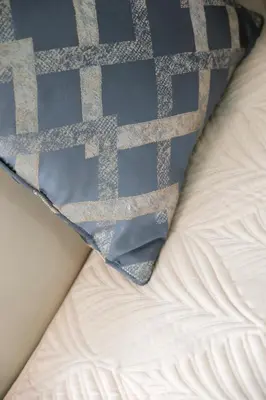 a tie laying on top of a bed at Manhattan Heights Modern Studio in Manila