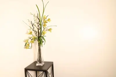 a vase of flowers sitting on a table at Home Away From Home in Manila
