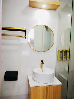 a bathroom with a sink and a mirror at Morena Suite in Dasmariñas