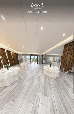 a banquet hall with white tables and chairs at Morena Suite in Dasmariñas