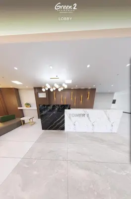 a lobby with a large marble counter in a building at Morena Suite in Dasmariñas