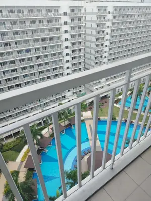an aerial view of the balcony of a large apartment building at Shell Residence by Jas O in Manila
