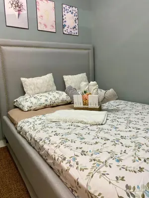 a bed with two boxes on top of it at Balay Hayahay Staycation in Manila